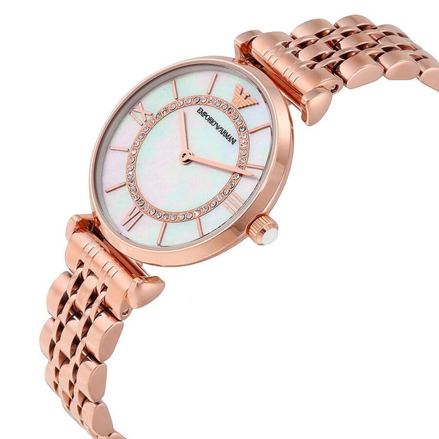 This Emporio Armani Gianni T-bar Analogue Watch for Women is the perfect timepiece to wear or to gift. It's Rose Gold 31 mm Round case combined with the comfortable Rose Gold Stainless steel watch band will ensure you enjoy this stunning timepiece without any compromise. Operated by a high quality Quartz movement and water resistant to 3 bars, your watch will keep ticking. This Elegant and practical watch is perfect for all occasions. It’s a great gift for your relatives and friends High quality 19 cm length and 13 mm width Rose Gold Stainless steel strap with a Deployment clasp Case diameter: 31 mm,case thickness: 7 mm, case colour: Rose Gold and dial colour: Mother of pearl