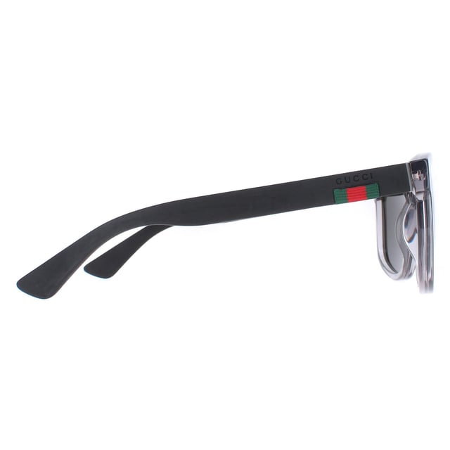 Gucci Rectangle Mens Transparent Grey and Black Grey Polarized GG0010S  Sunglasses are a sophisticated lightweight D-frame model with bi-chromatic styling. The frame is an easy to wear shape that suits the majority of face shapes and is completed by Gucci's distinctive red and green brand logo.