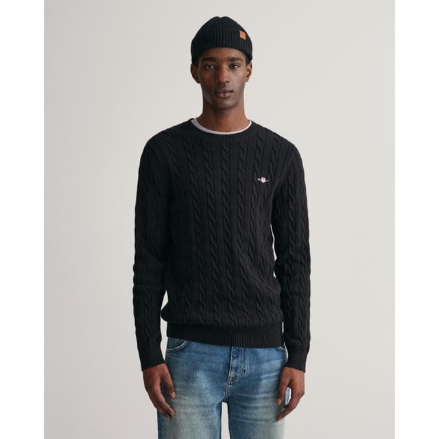 Designed in a soft cotton all-over cable knit, this sweater features our classic GANT shield embroidered at the chest, and ribbed endings at the hem and cuffs. A cable knit sweater adds a dimension of texture to your ensemble and pairs well with jeans and pants alike.
Regular fit  Crew neck  GANT graphic embroidered at chest
 
Cotton 100%
 
8050601
 
 