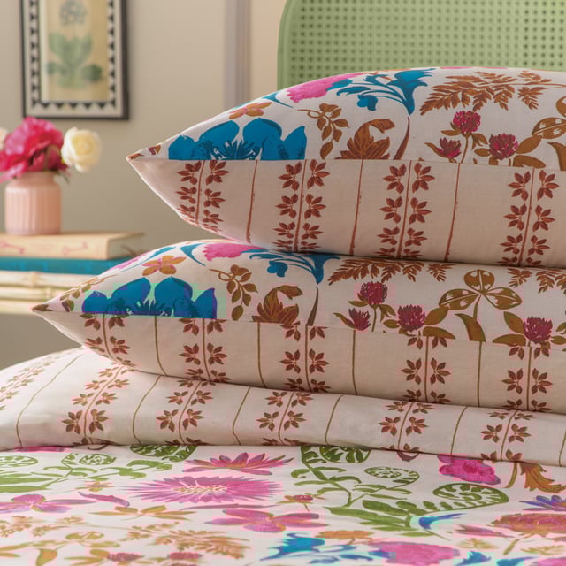Inspired by the gardens of India, the Curious Lotus duvet cover set is filled with intriguing exotic florals and fauna. Bright pinks, cobalt blues, and warm pecans intertwine to create an eye-catching print. Complete with an intricate striped reverse, providing you with two distinct looks for a midweek refresh.