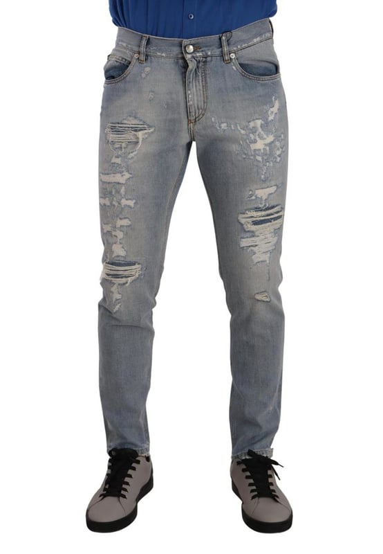 100% Authentic Dolce \u0026 Gabbana tattered denim jeans.\n  Crafted from cotton.\n  Zipper and button closure.\n  Straight fit.\n  Light blue color.\n  Regular fit.\n  Made in Italy.\n  Logo details.\n  Material: 100% Cotton.
