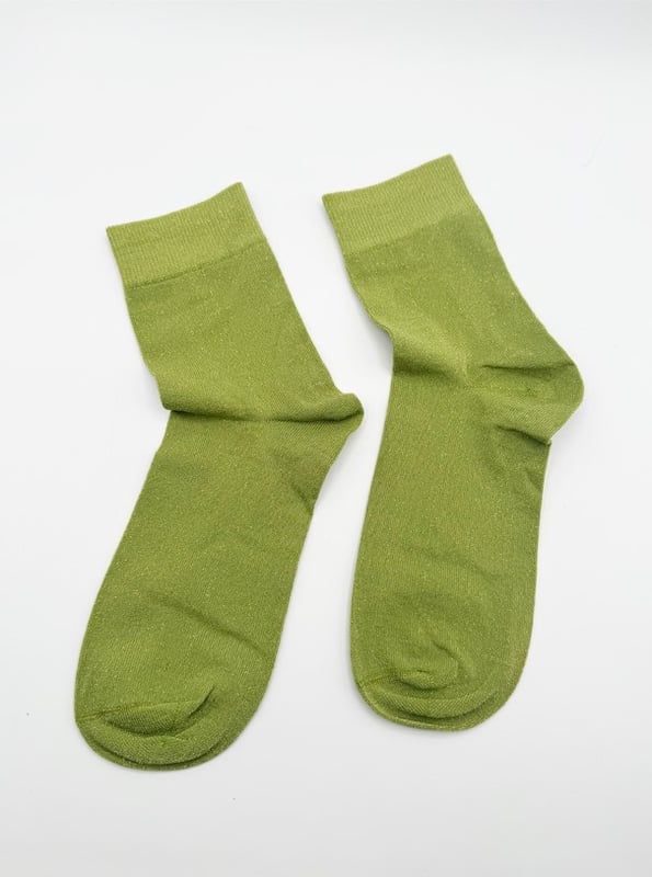 Get into the spirit of the season with this fun and vibrant glitter sock set by SVNX. Featuring two pairs in bold orange and green, they're perfect for adding a pop of sparkle to any outfit. Treat yourself or surprise someone special with a gift that combines style and festive flair! Knitted Glitter Socks Set. One size. 2 pairs. Gift Box. Cotton/Polyamide/Elastane. Wash at 40. Made in China