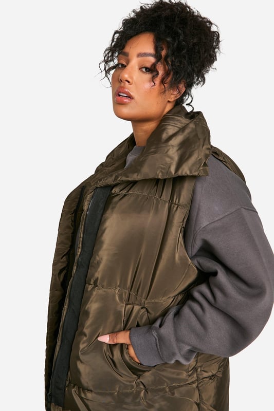 Add the finishing touch to your outfit with this outerwear piece from our women's plus size coats range. A wardrobe staple that's perfect for layering, this style provides added warmth and adds an extra something to your fit. Made with added fabric for the perfect fit, this piece is a whole vibe - just throw on over your fave outfit and you're sorted. Whether you choose a plus size denim jacket or keep things cosy in winter with a plus size teddy coat we've got the hottest coats for curvy girls that are always on-trend. Style: GiletFabric: NylonLength: LonglineNeckline: CollaredSleeve Length: Sleeveless