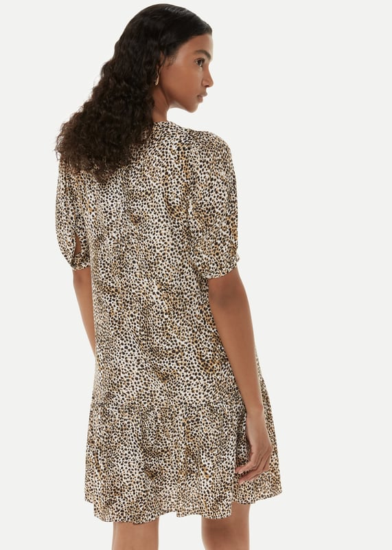 Experience elegance with the Ink Spot Midi Dress - perfect for any special occasion.
