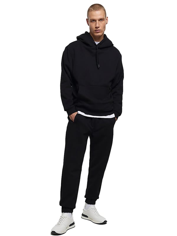 Expertly crafted for both casual and work wear, the Kruze Mens Tracksuit Set boasts unparalleled comfort and versatility. The crew neckline and long sleeves of the hoodie provide a timeless style, while the joggers feature an adjustable waistband and drawstrings for a perfect fit. Accompanied by side pockets and cuffed ankles, this set is ideal for any occasion. 52% Cotton, 48% Polyester. Available in Black, Grey and Navy colours.