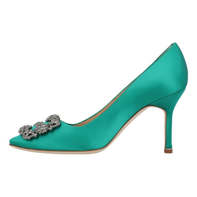 Satin almond toe pumps featuring a square crystal buckle encased in a gunmetal frame. Finished with a stiletto mid heel.

Upper: 68% viscose, 32% silk.
Sole: 100% cow leather.
Lining: 100% kid leather.
Heel measures 90 mm.
Made in Italy.
