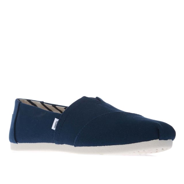 Womens Toms Recycled Cotton Canvas Alpargata Espadrille Pumps in navy.- Recycled cotton upper  lining and sock-liner made with 50% recycled cotton.- Classic Alpargata design.- Toe-stitch and elastic V for easy on and off.- Chevron patterned canvas lining.- Custom insoles made with 50% eco content including recycled PU foam.- Direct injection outsole for flexibility and durability with tread pattern for improved traction.- Toms branding to side and back of heel.- 100% vegan construction.- Textile upper  Textile lining  Synthetic and textile sole.- Ref:10017712