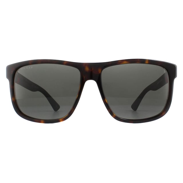 Gucci Sunglasses GG0010S 003 Havana and Grey Grey Polarized are a sophisticated lightweight D-frame model with bi-chromatic styling. The frame is an easy to wear shape that suits the majority of face shapes and is completed by Gucci's distinctive red and green brand logo..
