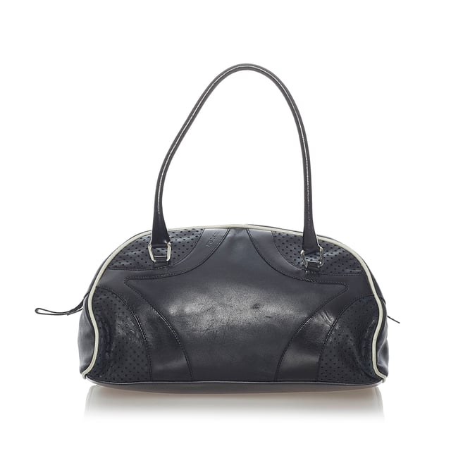 VINTAGE. RRP AS NEW. The Vitello Drive handbag features a perforated leather body, rolled leather handles, a top zip closure, and an interior zip pocket.Exterior back is out of shape and scratched. Exterior bottom is scratched. Exterior corners is scratched. Exterior front is out of shape and scratched. Exterior handle is out of shape and scratched. Exterior side is scratched. Zipper is scratched.

Dimensions:
Length 16cm
Width 28cm
Depth 10cm
Hand Drop 14cm
Shoulder Drop 14cm

Original Accessories: Dust Bag

Color: Black
Material: Leather x Calf
Country of Origin: Italy
Boutique Reference: SSU157102K1342


Product Rating: GoodCondition

Certificate of Authenticity is available upon request with no extra fee required. Please contact our customer service team.