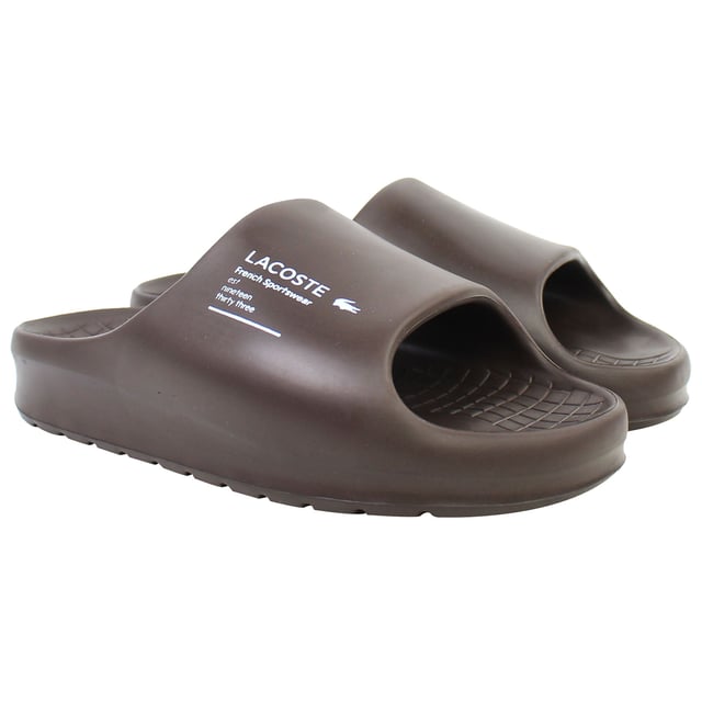 The Lacoste Serve Slide 2.0 223 2 CMA Men's BrownÂ Sliders deliver timeless style and exceptional comfort, making them a versatile option for casual wear, poolside lounging, or beach outings. These sliders feature a sleek design with iconic branding for a polished yet relaxed look.
Â 
Key Features:
Ergonomic Footbed: 

Contoured for superior comfort and support, ideal for extended wear.


Durable Synthetic Strap: 

Embossed with the signature Lacoste crocodile logo, adding a stylish and recognizable touch.


Slip-On Design: 

Easy to wear, offering convenience for relaxed occasions or quick outings.


Textured Rubber Outsole: 

Ensures reliable grip and traction on both wet and dry surfaces.


Lightweight Construction: 

Reduces fatigue, making them perfect for all-day comfort.


Water-Resistant Materials:

Designed to handle pool, beach, or shower environments without compromising durability.


Classic BrownÂ Colorway:Â 

A versatile and timeless design that pairs effortlessly with casual or sporty outfits.


Â 
The Lacoste Serve Slide 2.0 223 2 CMA Men's BrownÂ Sliders are a must-have for laid-back footwear, offering a combination of comfort, durability, and understated style for any relaxed occasion.
Â 
Â 
Â 