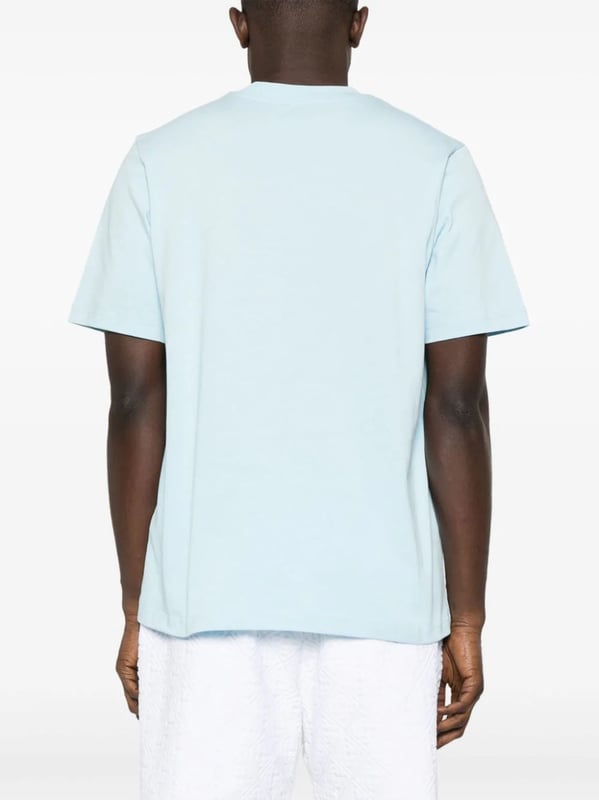 Casablanca's graphics often depict a fantastical world of sporty utopian scenes. The illustrative print on this organic cotton T-shirt portrays a Mexican-inspired landscape with a tennis court in the middle.
