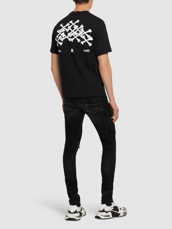 Paying homage to the Arts District of Los Angeles, Amiri's Bones Stacked T-Shirt is the perfect addition to your core staples. Expertly crafted in Italy from the finest jersey, this regular fit t-shirt for men is ideal for everyday wear, whether meeting friends for a night out, a day in the city, a walk in the part or a lazy weekend at home