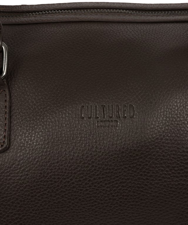 Crafted from natural leather with a supple and ultra-soft feel, the 'Ocean' holdall from Cultured London is the perfect bag for a when travel is on the agenda. The zip-over top secures the main compartment, concealing the 100% natural cotton lining. Two outer zipped pockets provide extra storage solutions, complemented by metal fittings. Comes with matching leather grab handles and an adjustable strap with a drop length of 70cm. Finished with the contemporary embossed Cultured London logo.