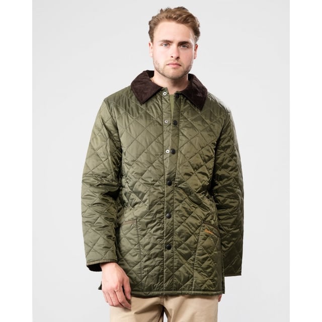 The Liddesdale provides plenty of room for laying and a generous fit, we suggest you go down one size if you prefer to wear this as a summer jacket. One of the most iconic Barbour jackets, the original Liddesdale jacket is a firm favourite year after year.
With Barbour's signature diamond quilted outer and a warm yet lightweight contrast nylon lining, this popular men's quilted jacket is durable, simple and stylish. From the Classic collection and available in a range of wearable colours, it features a robust front stud fastening to protect from the elements, and a smart sit-down cord collar that can be raised for additional warmth and protection, with a luxuriously soft feel against the skin.
With a generous fit, the Liddesdale provides plenty of room for layering up with chunky knits and insulating gilets, while the studded rear vents ensure comfort and ease of movement. The signature front patch pockets are trimmed with contrast Barbour embroidery and are generously proportioned, while a zipped inner security pocket safeguards valuables. A timeless addition to any winter wardrobe.

Regular Fit
100% polyamide
Two inch box quilted with 100g polyester wadding
Machine washable
Back length: 30-34in / 76.3-86.3cm