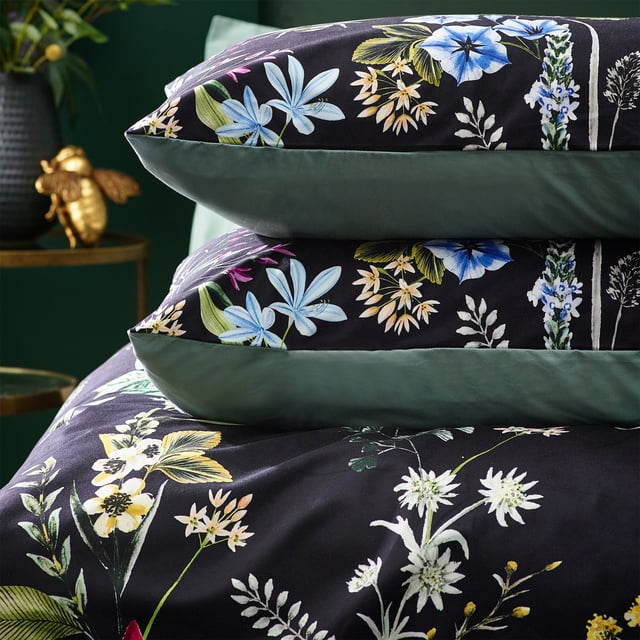 A striking digitally printed duvet set featuring an eye-catching contrast design, which will brighten up your bedroom in an instant, Busy bees hover among the bright, fresh florals of a meadow or garden, which are set on a contrasting luxuriously soft velvet jet black background. This exquisite set adds lovely pops of colour to your bedroom and gives it a natural feel too, helping you wake up in the morning and feel refreshed.