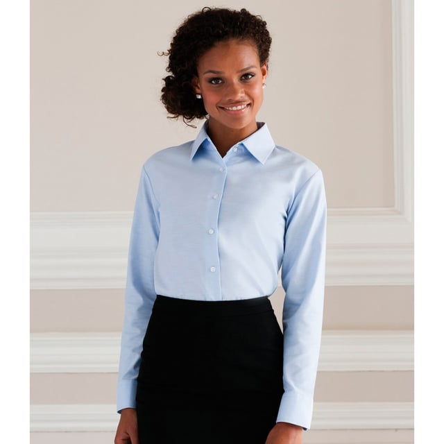 Tried and tested workplace staple that combines exceptional durability with great attention to detail. Elegant ladies shirt cut, high quality Oxford fabric with excellent finish. 2 button collar stand with classic shaped collar. Darts at bustline and back for tailored fit. Rounded 2 button adjustable cuffs. Rounded hem. The darts on the back panel are positioned in the lower part, to allow for unrestricted decoration possibilities on the upper part. Also available in mens sizes, code 932M. Weight: 130-135g/m². Fabric: 70% Cotton 30% Polyester Oxford. XS (30-32: To Fit (ins), 8: Dress Size). S (32-34: To Fit (ins), 10: Dress Size). M (34-36: To Fit (ins), 12: Dress Size). L (36-38: To Fit (ins), 14: Dress Size). XL (38-41: To Fit (ins), 16: Dress Size). 2XL (41-44: To Fit (ins), 18: Dress Size). 3XL (44-47: To Fit (ins), 20: Dress Size). 4XL (47-51: To Fit (ins), 22: Dress Size). 5XL (51-54: To Fit (ins), 24: Dress Size). 6XL (54-57: To Fit (ins), 26: Dress Size). RUSSELL COLLECTION - a variety of Mens and Womens corporatewear in a wide range of styles, colours and sizes.