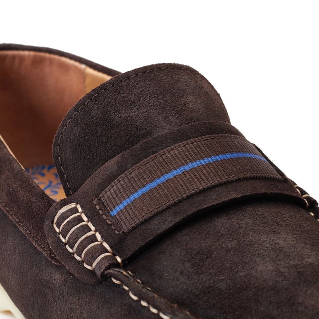 Base London Drum Leather Men's Burnt Brown Loafers The Drum loafer from Base London is your casual summer staple. The soft suede uppers and Ortholite insole provide a comfy ride while the detailing on the nylon strap across the vamp elevates this style and gives it character.
