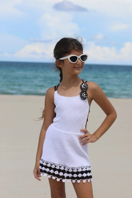 Nessi Byrd incorporate captivating materials into their everyday luxury swimwear. This girls Agave black girls skirt amplifies the New York label's passion for dynamic luxury and resortwear. Crafted with crochet accessories at the ends in a textured fabric and elasticated waistband. She will look and feel divine. Crochet Material 100% Cotton