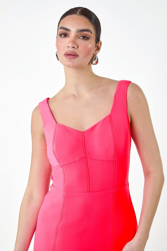 A-Plain Corset Drs from Roman. Get ready to be the best-dressed guest this season in our striking Ariella stretch dress. This knee-length stunner features a bold pop of colour and mock corsetry detailing that creates a flattering fit. The cute sweetheart neckline and feminine, fitted shape make it a special occasion staple, topped off with wide straps for comfort and coverage. Finished with a visible zip back fastening and crafted in stretch jersey fabric, this dress exudes effortless glamour. Pair with strappy heels and a fascinator for a wedding reception or a day at the races this Summer.