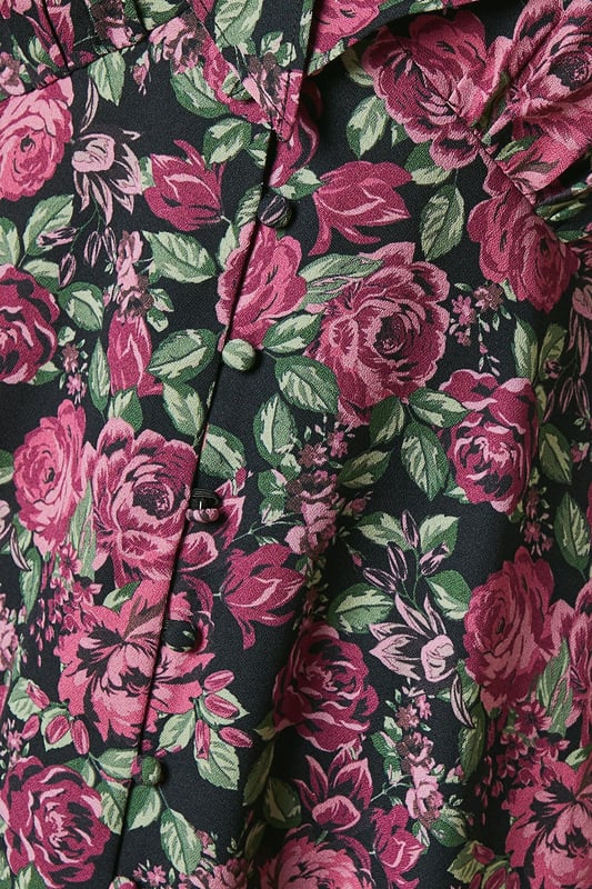 Charming floral print blouse with a romantic ruffle neck detail
        Flattering V-neckline with button-front closure for easy wear
        Long sleeves with subtle gathering at the shoulders for a feminine touch
        Elegant tie-back detail to accentuate the waistline
        Versatile tea blouse style suitable for various casual occasions
    
    Embrace effortless elegance with this Dorothy Perkins petite floral blouse. Perfect for the fashion-conscious woman in her 30s, this piece strikes the ideal balance between trendy and modest. The ruffle neck and button-front design add a touch of vintage charm, while the long sleeves provide comfort and coverage. Style this versatile top with slim-fit trousers and ballet flats for a chic brunch look, or pair it with dark denim and ankle boots for a casual family gathering. The tie-back detail allows for a customised fit, ensuring you look polished whether you're attending a baby shower or meeting friends for coffee. This blouse is a wardrobe essential that seamlessly transitions from day to evening, making it the perfect choice for the modern woman who values both style and practicality.