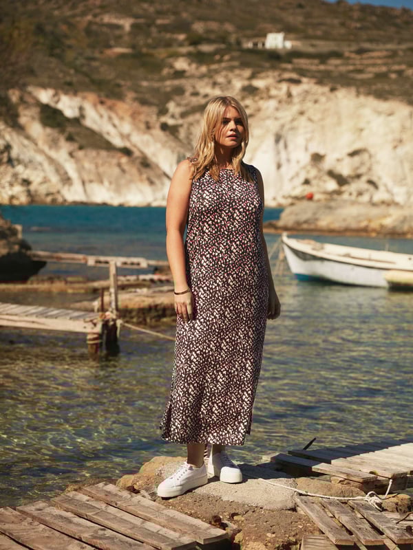 Printed all over in a pretty ditsy print, this maxi dress is cut from the softest of jerseys which moves beautifully. With a flattering column shape, it has a round neck for that all-important coverage, while its sleeveless shape allows you to keep cool in the warmer months. Side slits create space and movement, making this dress as comfortable as it is stylish.