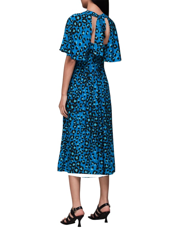 Step out in sustainable style with our 'Painted Leopard Midi Dress', perfect for adding a splash of colour and pattern to your day. Whether enjoying leisure time or dressing up for a casual outing, this eco-conscious piece with its tie neck and comfortable fit brings an effortless flair to any wardrobe.
