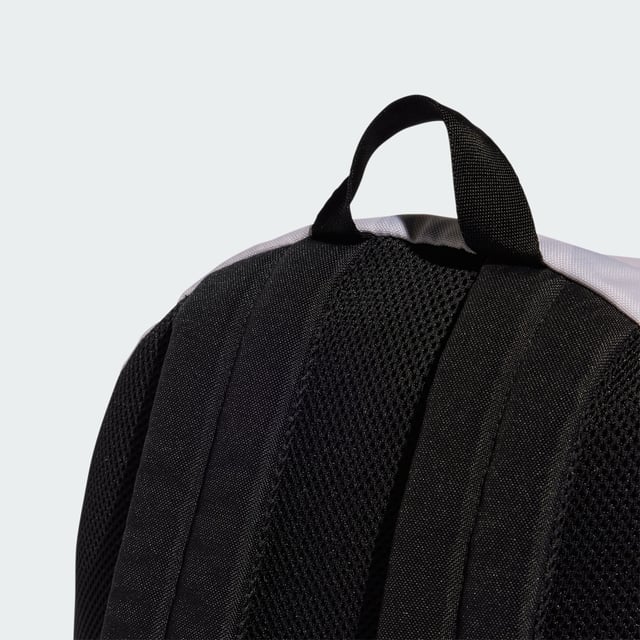 A classic pack with an edgy look. This adidas backpack lends fresh attitude to your casual outfits thanks to a cool allover print. Roomy enough for all your essential gear, it has a zip main compartment, front zip pocket and side slip-in pockets to keep everything organised. Padded adjustable straps add comfort if the bag gets heavy. This product is made with at least 50% recycled materials. By reusing materials that have already been created, adidas help to reduce waste and our reliance on finite resources and reduce the footprint of the products adidas make.  - Dimensions: 15 cm x 36 cm x 44 cm - Volume: 27.5 L - 100% polyester (recycled) - Zip main compartment - Front zip pocket - Side slip-in pockets - Padded adjustable straps  Shipped by adidas