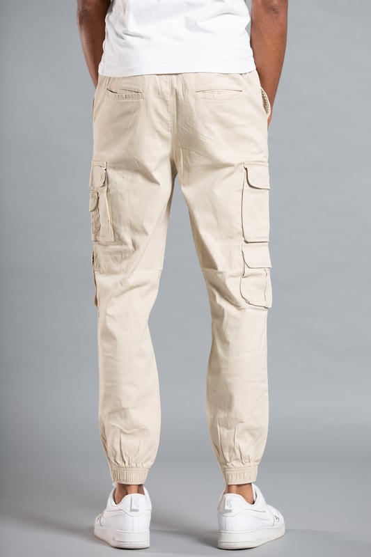 These cargo-style trousers from Tokyo Laundry are wardrobe staples. Made from soft cotton fabric, these trousers are perfect for everyday wear. Featuring two side pockets, four cargo-style pockets and two back pockets, a drawstring with toggle, elasticated waistband and cuffs and Tokyo Laundry branding on the front. Machine washable for easy care.