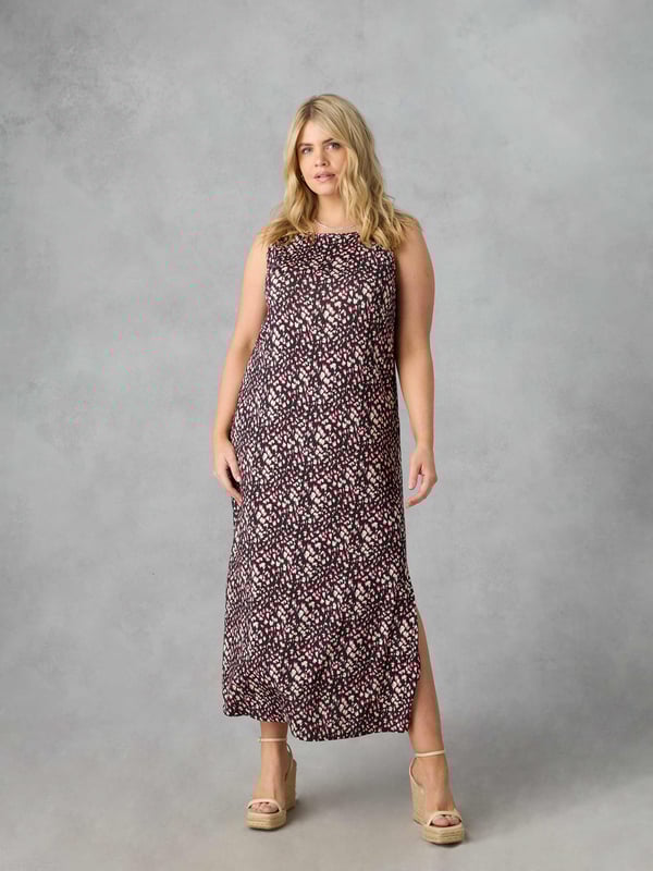 Printed all over in a pretty ditsy print, this maxi dress is cut from the softest of jerseys which moves beautifully. With a flattering column shape, it has a round neck for that all-important coverage, while its sleeveless shape allows you to keep cool in the warmer months. Side slits create space and movement, making this dress as comfortable as it is stylish.