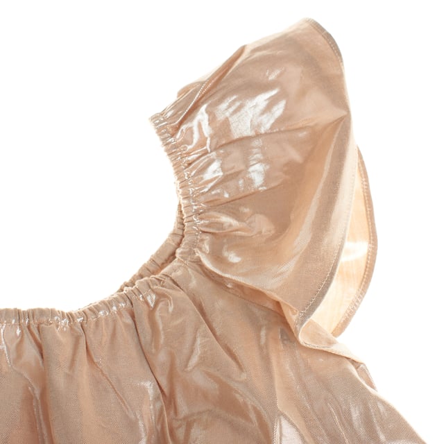 This girls' blouse stands out for its shiny, flowing fabric, which gives it an elegant and festive touch. It features a wide, flared sleeve design, which adds volume and a sophisticated look.

 The neckline has a gathered detail with elastic, ensuring a comfortable and flexible fit.

 The bottom of the blouse falls in light layers, providing a fluid, loose silhouette.

 It is an ideal garment for special occasions, perfect to complement a distinguished and fashionable look.
 Composition: Exterior: 74% Viscose, 26% Metallic; Interior: 100% Cotton
 Care:
- Machine wash cold on delicate cycle.
 - Use mild detergents.
 - Use dryer at low temperature.
 - Iron at low temperatures.
 - Do not dry clean.