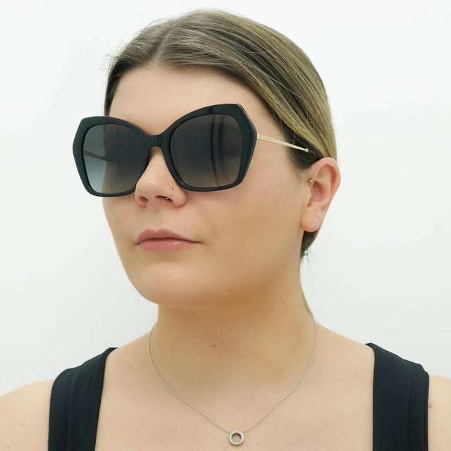 Dolce & Gabbana Butterfly Females Black Grey Gradient DG4399  Sunglasses are a fashionable and trendy eyewear option for Female from the luxury fashion brand. With a chic square frame made of high-quality acetate, these sunglasses feature tinted lenses that provide 100% UV protection. The unique gold-tone temple detailing with the iconic Dolce & Gabbana logo adds a touch of glamour and sophistication to the design, making them a perfect accessory for style-conscious Female.