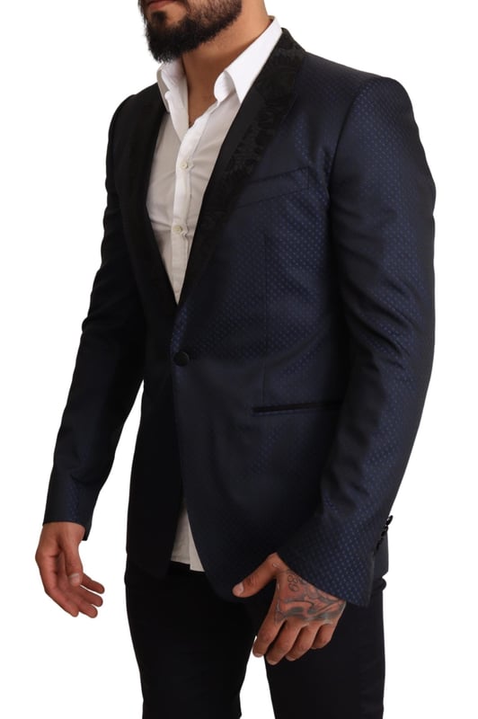 Stunning Dolce & Gabbana MARTINI Slim Fit Blazer Jacket
  Single breasted one-button style
  Slim fit for a great fitting and comfort
  Beautiful blue color
  Three outside pockets and two inside pockets
  One open vent in the back for breathability
  Logo details for a signature touch
  Made in Italy with premium materials
  Material: 6% AC 50% PL 11% Silk 33% Wool
  Lining: 100% Silk
Material: 6% AC 50% PL 11% Silk 33% Wool