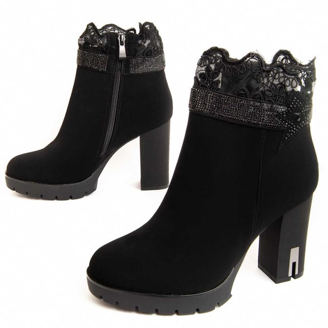 Heeled ankle boots for women. Comfortable fit. Made with vegan materials. Made by other brands for our brand. Approximate measurements: 10 cm heel, 2 cm platform, 13 cm shaft height, and 10 cm shaft width.