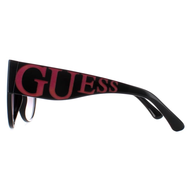 Guess Cat Eye Womens Shiny Black Smoke Gradient GF6118  Sunglasses are a cat-eye style crafted from lightweight acetate. The brand's logo is showcased on the temples for authenticity.
