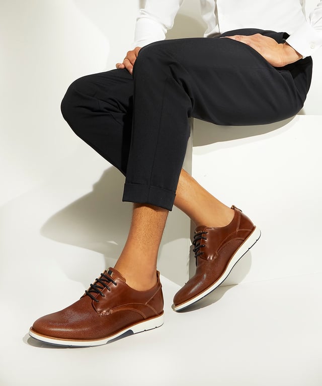 Dune Mens BARNABEY Casual Gibson Shoes Barnabey Classed as a more relaxed variation to the classic Derby silhouette, embrace tactile finishes this season with style Barnabey. This casual Gibson shoe starts life in Portugal and is crafted with the finest materials, culminating in a combination of smooth textures, perforated and handstitched detailing, and a four-eyelet lacing system. Finished with a pull tab and contrasting sole, Barnabey pairs perfectly with chinos and chambray shirts.