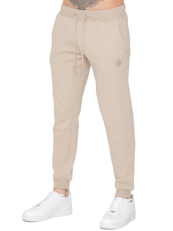Upgrade your casual wardrobe with these Men's Slim Fit Joggers from Only. Designed for both comfort and style, they feature an elasticated waist with a drawstring for a customizable fit. The Enzo logo is elegantly embroidered on the leg, adding a touch of refinement. With a practical 2-pocket design and fleece lining, these joggers combine functionality with warmth, making them perfect for everyday wear.