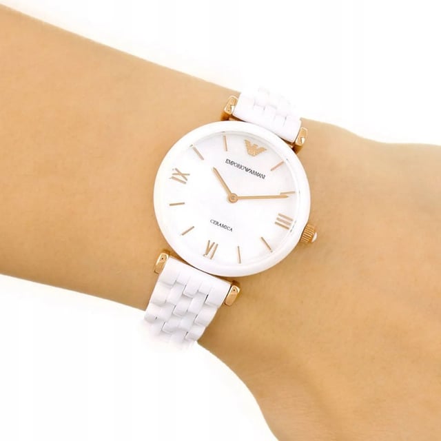 Brand: Emporio ArmaniModel Number: AR1486Part Number: AR1486Item Shape: RoundDial Window Material Type: MineralDisplay Type: AnalogClasp: Deployant Clasp with Double Push ButtonCase Material: CeramicCase Diameter: 32 millimetersCase Thickness: 7.5 millimetersBand Material: CeramicBand Size: Women’s StandardBand Width: 14 millimetersBand Color: WhiteDial Color: WhiteBezel Material: CeramicMovement: Quartz