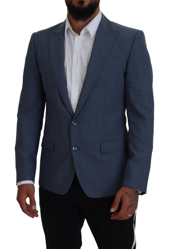 Absolutely stunning 100% Authentic brand new with tags Dolce & Gabbana blazer
  Single breasted style with a blue color and blue inner lining
  Two-button closure
  Logo details
  Made in Italy
  Material: 92% Wool 7% Elastane 1% Polyester
  Lining: 36% Cupro 33% Rayon 31% Acetate
Material: 92% Wool 7% Elastane 1% Polyester