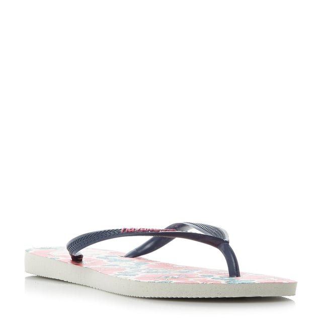 Embrace flower power this summer with this pretty floral print flip flop. This toe post style features slim straps with brand logo detailing.