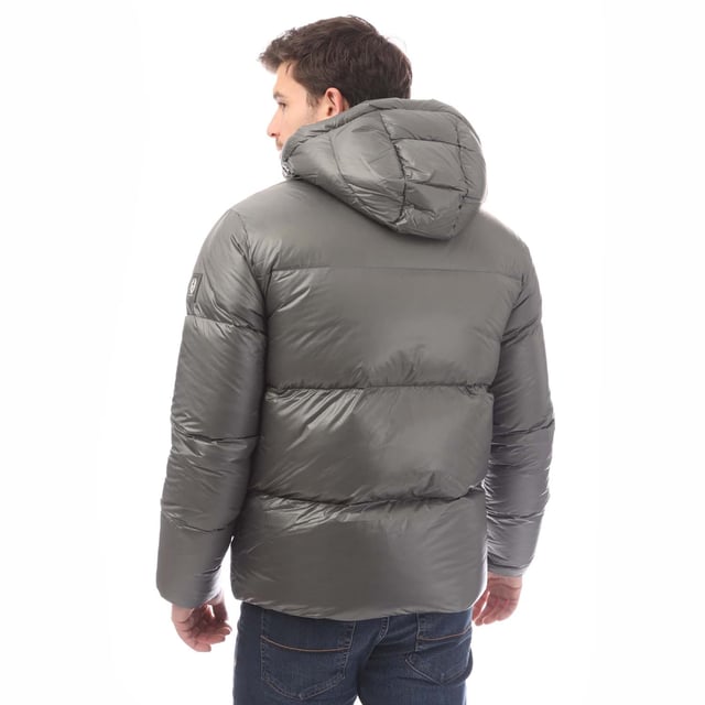 Mens Belstaff Down Filled Ripstop Resolve Jacket in grey.- Hood and hem drawcord.- Zip fastening hip pockets.- Water resistant centre front zip.- Silicone phoenix badge on left sleeve.- Packable functionality.- Water repellent.- 100% RDS certified down and feather (IDFL CERT TE-00103785) with PFAS free water-repellent finish.- High-shine  100% recycled nylon in a micro ripstop construction.- High performance  lofty  ultralight and highly insulating down jacket style.- 100% Polyamide.- Ref: 105161GMETL