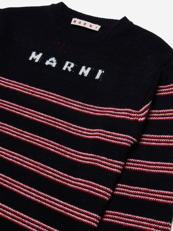 Introducing the Girls Knitted Striped Dress in Black by Marni, the epitome of high-end style for AW2024. Meticulously crafted for the chic young girl's wardrobe, experience the synthesis of luxury and playful elegance. Exquisite Craftsmanship: Precision knitting from luxury yarns ensures durability and aesthetic appeal. Bold Stripes: Classic black stripes introduce a timeless, fashionable edge to any occasion. Soft and Comfortable: Ultra-soft fabric guarantees all-day comfort, perfect for both special events and casual outings.Elevate your child's fashion game with Marni's Striped Dress in Black. A standout addition for any young fashionista's collection.
