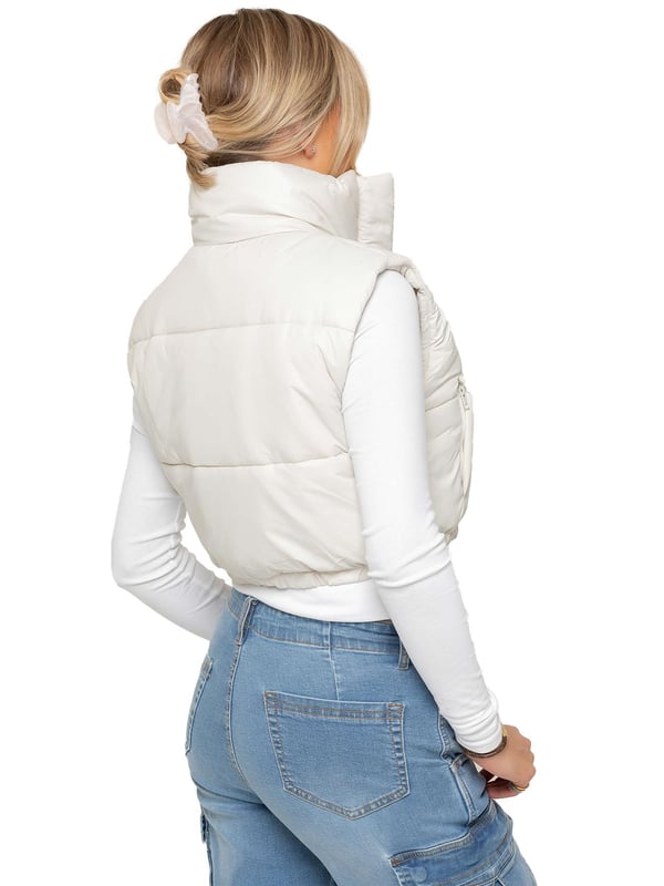 The Enzo Women's Puffer Gilet combines style and functionality with its water-repellent design and high neck for extra warmth. It features zipped side pockets for secure storage, while the adjustable hem with elasticated drawstrings ensures a tailored fit. With a full zip-up front and lined interior, this gilet offers both comfort and practicality. Made from 100% polyester, it's durable and machine washable for easy care.