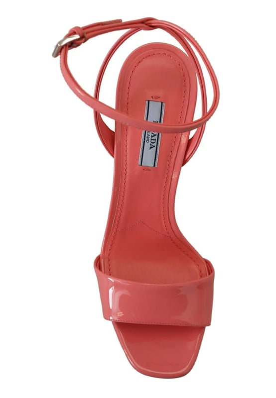 Brand: PRADA
  Condition: Brand new with tags
  Model: Block heels platform sandals
  Color: Pink
  Material: 100% patent leather
  Leather bottom sole for durability
  Logo details showcasing the iconic PRADA brand
  Made in Italy with high craftsmanship
  Exclusive and luxurious design
  Perfect for fashion-forward women
Material: 100% patent leather