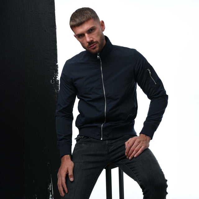 Mens Jack and Jones Mash Harrington Jacket in navy.- Stand-up collar.- Full zip fastening.- Two press-stud pockets.- Zip sleeve pocket.- Inner pocket.- Ribbed cuffs and hem.- 100% Polyester. - Ref: 12255835