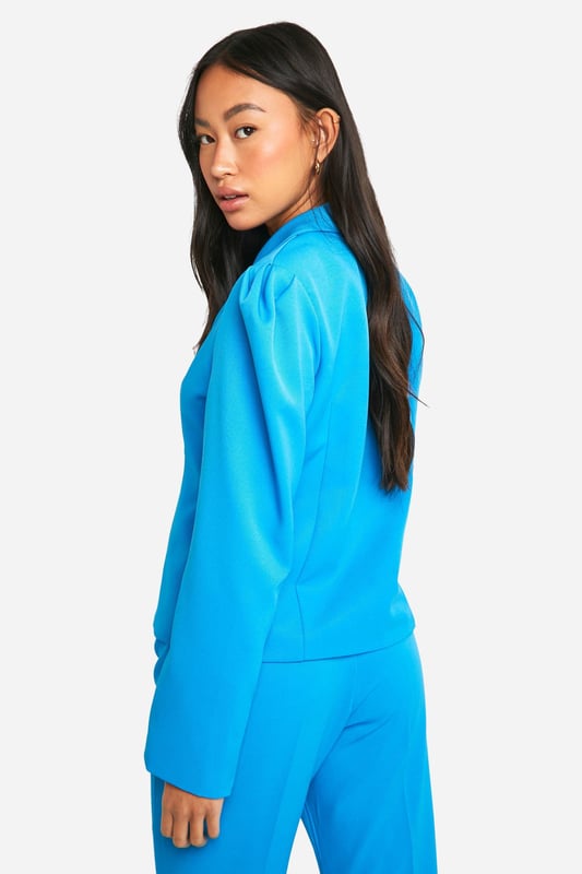 Structured woven crepe fabric for a polished look
        Slim fit design accentuates the silhouette
        Notched lapel collar adds a classic touch
        Double-breasted front with statement buttons
        Long sleeves for versatile styling options
    
    Make a bold statement with this eye-catching structured blazer from Boohoo. Perfect for the fashion-forward woman who loves to stand out, this piece combines sleek design with vibrant flair. The slim fit hugs your curves in all the right places, while the woven crepe fabric offers a luxurious texture that's sure to turn heads. Whether you're heading for a night out or looking to add some pizzazz to your office attire, this blazer has got you covered. Style it with the matching wide-leg trousers and strappy heels for a show-stopping ensemble that's ready for any social occasion. For a more casual look, pair it with your favourite jeans and trainers. The versatility of this blazer makes it a must-have addition to your wardrobe, perfect for those who love to mix and match their style.