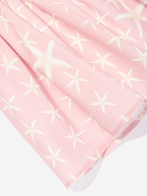 Introducing the Baby Girls Starfish Marina Dress in Pink by Versace, an essential upgrade for your little fashionista‚  AW2024 wardrobe from Italy. Experience the blend of luxury and playfulness. Key features include: Italian Luxury: Impeccably crafted in Italy, synonymous with unparalleled quality. Iconic Starfish Motif: Embellished with a chic starfish print, capturing the essence of whimsical elegance. Premium Fabric: Constructed with the softest fabrics to ensure comfort and ease for all-day wear. Perfect Pink: A vibrant pink hue that complements the playful design, making it a strikingly beautiful garment.revitalise her collection with this stunning designer dress by Versace. Order now for timeless style and unmatched quality!