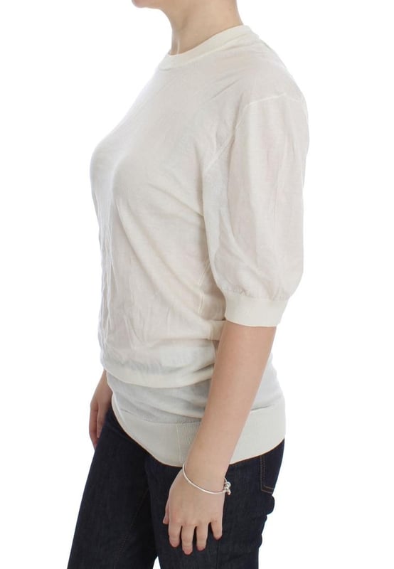 Brand: Dolce \\u0026 Gabbana.\\n  Condition: Brand new with tags.\\n  Material: 100% cashmere.\\n  Color: White.\\n  Sleeve: 1/2 sleeve.\\n  Made in Italy.\\n  Logo details.