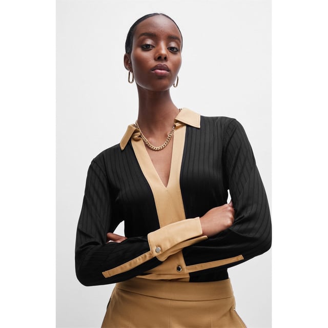Boss Elanty Ribbed Long-Sleeve Blouse with Johnny Collar in black.- Long sleeves.- Button cuffs.- Stretch material with contrast trims.- Slim fit.- 93% Viscose  5% Polyamide  2% Elastane.  Machine washable.- Ref: 50505794001