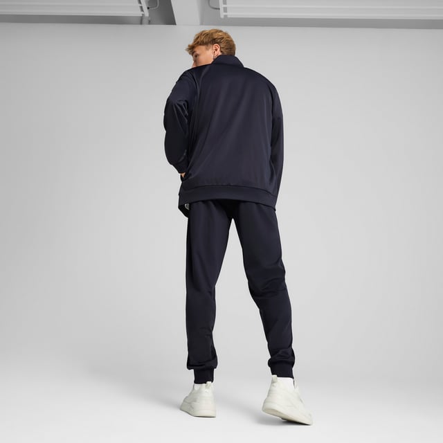 PRODUCT STORY: These everyday essentials feature a high-collar jacket with rib cuffs and waistband, plus pants with an elastic waistband and internal drawcord for customized comfort. PUMA No. 1 Logo rubber prints and piping details complete the look. FEATURES & BENEFITS: Made with at least 90% recycled materials. DETAILS: Regular fit; High-collar; Elastic waistband with internal drawcord; Ribbed cuffs; Closed bottom; PUMA branding details; 100% polyester Recycled - tricot - 220.00 g/m - piece dyed - Mechanical - Brushing, Mechanical - UPFMain Material 3: 100% polyester Recycled - tricot - 220.00 g/m - piece dyed - Mechanical - Brushing, Mechanical - UPF.  Our model is 180 cm tall and is wearing size M UK.
