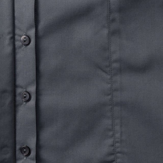 One of the great classic shirt fabrics, combining elegance with durability and wearer comfort. Smart and stylish fitted shirt design in a fine poplin fabric. Concealed placket. Stylish yoke design. Darts on bust front hem and back panel for fitted shape. Decorative top stitch on darts. Modern rounded 2 button cuffs. Rounded hem. The elegant lightweight fabric is especially suited for finer embroideries. Also available in mens sizes, code 924M. Weight: 110- 115g/m². Fabric: 65% Polyester, 35% Cotton. XS (30-32: To Fit (ins), 8: Dress Size). S (32-34: To Fit (ins), 10: Dress Size). M (34-36: To Fit (ins), 12: Dress Size). L (36-38: To Fit (ins), 14: Dress Size). XL (38-41: To Fit (ins), 16: Dress Size). 2XL (41-44: To Fit (ins), 18: Dress Size). 3XL (44-47: To Fit (ins), 20: Dress Size). 4XL (47-51: To Fit (ins), 22: Dress Size). RUSSELL COLLECTION - a variety of Mens and Womens corporatewear in a wide range of styles, colours and sizes.